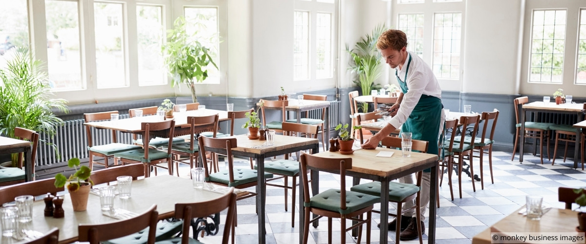 Server presenting check with composed demeanor