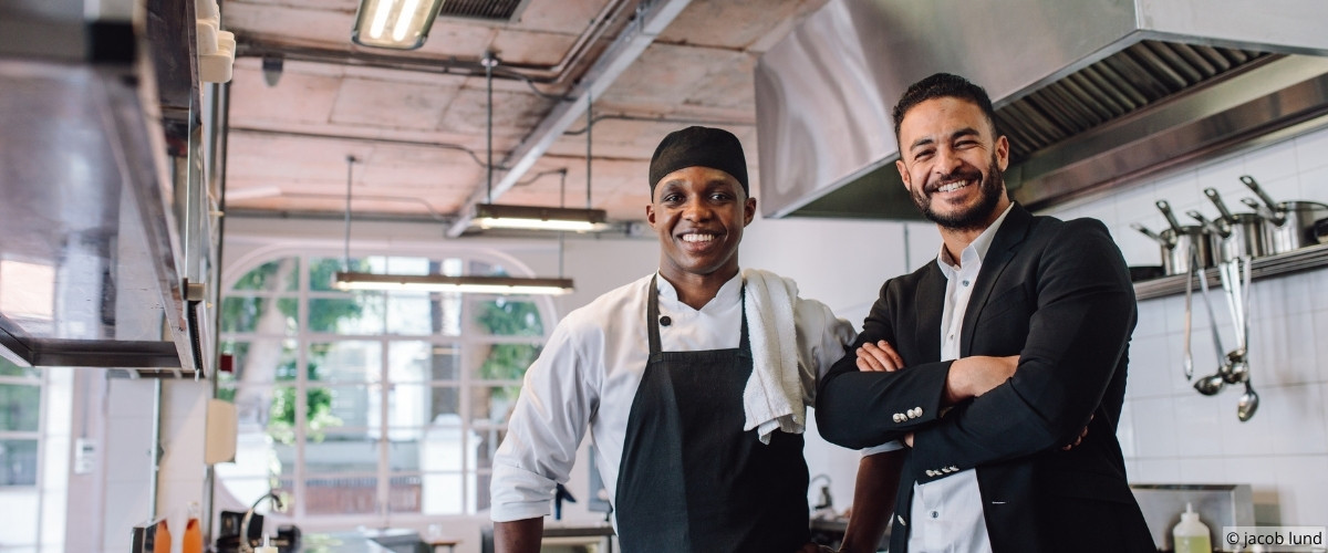 Manager speaking attentively with guest